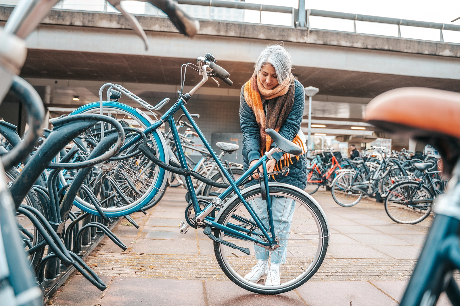 Senior woman gets bike parking