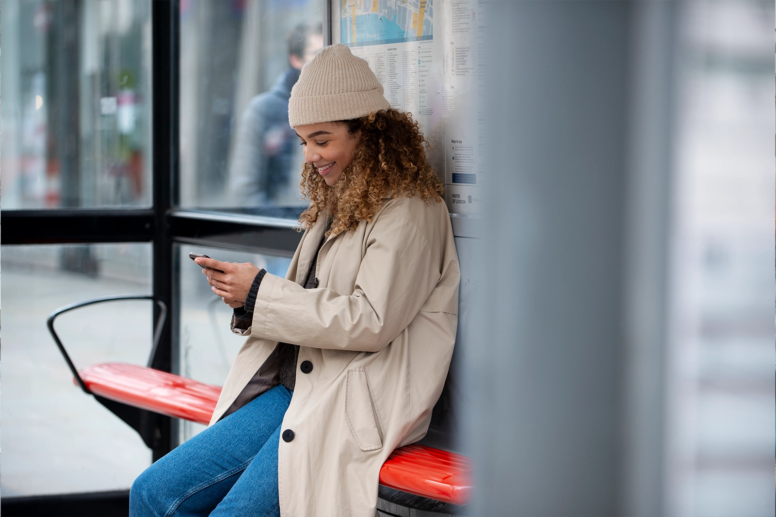 Young woman using her smartphone city